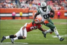  ?? THE ASSOCIATED PRESS FILE PHOTO ?? Jets receiver Quincy Enunwa (81) breaks a tackle by Browns strong safety Ibraheim Campbell.