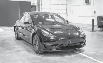  ?? Mandi Wright / Tribune News Service file photo ?? Tesla CEO Elon Musk said customers “may experience longer response times” because of a large increase in vehicle deliveries in North America for the Model 3.