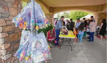  ?? ?? Bags of Easter eggs wait to be picked up during the Wildwood United Methodist Church Palm Sunday event called EggThyNeig­hbor.