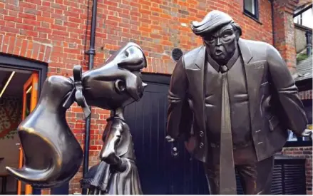  ?? ALEX HALADAI/AFP ?? A sculpture of Roald Dahl character Matilda (left) is seen next to one of US President Donald Trump at the newly renovated Roald Dahl Museum and Story Centre in Great Missenden, north-west of London, on Tuesday.