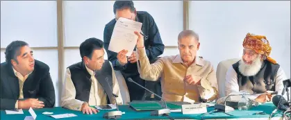  ?? AGENCIES/F ?? (Top) Pakistan’s Prime Minister Imran Khan (centre) along with other lawmakers during a rally; Opposition leader Shehbaz Sharif (second right), along with Bilawal Bhutto Zardari (left) and Maulana Fazal-ur-Rehman (right) and MQM leader Khalid Maqbool Siddiqui (second left), in Islamabad.