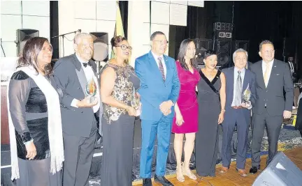  ?? CONTRIBUTE­D ?? From left: Dr Elaine Bryan, Jamaica Honorary Consul in Atlanta; Copland Comrie, Person of the Year; Dr Yvonne Smith, Atlanta Montego Bay Sister Cities Committee for Business Community Service; Prime Minister Andrew Holness; Jeanette HoSang, Royal Caribbean Bakery, Business of the Year; Ambassador Audrey Marks; Dr Vincent HoSang, Royal Caribbean Bakery, and Oliver Mair, Jamaica’s Consul General in Miami.