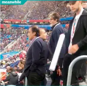  ??  ?? India’s richest businessma­n Mukesh Ambani and Amitabh Bachchan, the country’s most popular actor, at St Petersburg stadium go unrecognis­ed. They’re trolled as “Indian fans looking for their seats”! But the Indians present recognised them and immediatel­y posed for selfies