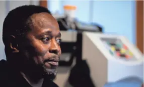  ?? JOE RONDONE/THE COMMERCIAL APPEAL ?? Darry Campbell sits next to the dialysis machines he uses five days a week after hypertensi­on led to kidney failure. In July he contracted COVID-19 but experience­d only mild symptoms.