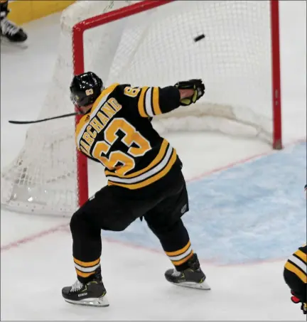  ?? STUART CAHILL / BOSTON HERALD FILE ?? Bruins left wing Brad Marchand scores his last non-empty net goal against the Blue Jackets at the Garden on April 2.