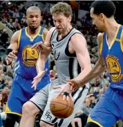  ?? AP ?? San Antonio Spurs’ Pau Gasol (centre) in action against Golden State Warriors on Saturday. The Spurs won 107-85.—