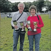  ??  ?? Arthur and Peggy MacEachern of Keills won best exhibit in the horticultu­ral section with a double begonia. 16_T33_ Islay Show_ 29