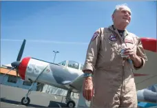  ?? RECORDER PHOTO CHIEKO HARA ?? Byron Fox, one of the lead pilots of the organizati­on, discusses his love of flying Friday, at the Portervill­e Airport. About 40 vintage airplanes flew into the City of Portervill­e. BY