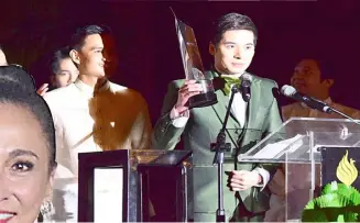  ??  ?? “SIGNAL Rock” lead actor Christian Bables (above) accepts a citation for their movie. The night’s host and seasoned actor, Cherie Gil (left), earned her first Urian for her portrayal of a pimp in “Citizen Jake.”