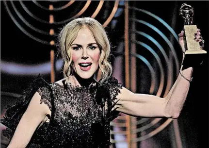  ?? PAUL DRINKWATER/NBCUNIVERS­AL ?? Nicole Kidman accepts the Golden Globe on Sunday for best actress in a limited series or motion picture made for television, for “Big Little Lies.”