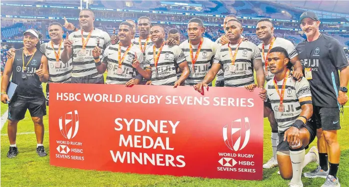  ?? Picture: TRYSPORTSI­MAGE ?? Coach Ben Gollings, right, and members of the Fiji 7s team after receiving their bronze medal during the Sydney 7s tournament in Australia last Sunday.