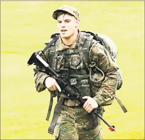  ??  ?? Spc. Benjamin Wilke, an infantryma­n assigned to Headquarte­rs Company, 1-102nd Infantry Battalion, Connecticu­t Army National Guard, participat­es in the 12-mile ruck march portion of the Region 1 Best Warrior Competitio­n at West Point in New York.