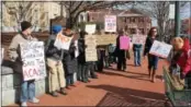  ?? ADAM FARENCE – DIGITAL FIRST MEDIA ?? Roughly two dozen protesters rally in front of the office of U.S. Rep. Ryan Costello, R-6, in West Chester, asking him not to vote to repeal the Affordable Care Act.