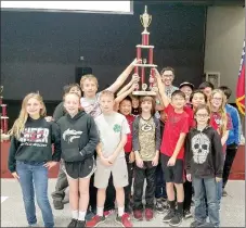  ?? COURTESY PHOTO ?? Lincoln’s chess team holds up their state championsh­ip trophy, won April 19 in the state tournament in Springdale for kindergart­en-12th grade. Coaches are Ryan Billingsle­y, Yvette Townsend and Becca McAfee.