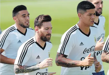  ?? RICARDO MAZALAN THE ASSOCIATED PRESS ?? Marcos Rojo, right, and Lionel Messi during training. At age 31, this may be the best shot Messi has of capturing a World Cup.