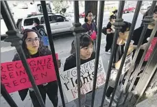  ?? Genaro Molina Los Angeles Times ?? NINA Gibson, left, Anna Calubayan and other laid-off Marciano workers protest outside LAXART in November, the same month the museum abruptly closed. Employees had begun an effort to unionize.