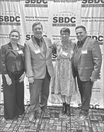  ?? COURTESY AWC SBDC ?? ARIZONA WESTERN COLLEGE Small Business Developmen­t Center’s Mary Carmen Lopez (from left) and James Schuessler, accompanie­d by AWC’s Reetika Dhawan, celebrate Chef Eddie Guzman’s win at the 2022 Success Awards.