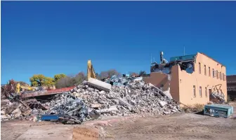  ?? EDDIE MOORE/JOURNAL ?? A pile of rubble had accumulate­d during the early stages of demolition of the old Santa Fe County courthouse this month at Grant and Griffin.