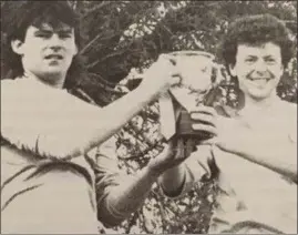  ??  ?? Injured skipper Tony Crosbie and captain for the day Eamon Murphy after the North End first team beat their seconds to clinch the Grattan Esmonde Cup in 1990.