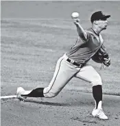  ?? CHARLES TRAINOR JR ctrainor@miamiheral­d.com ?? Robert Dugger delivers four shutout innings Monday in a simulated game at Marlins Park. He’s aiming for better results than he had late last season with the Marlins.