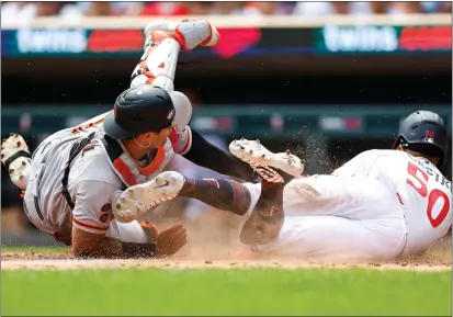  ?? DAVID BERDING — GETTY IMAGES ?? Willi Castro of the Twins steals home in front of Giants catcher Blake Sabol during the third inning of Wednesday's game in Minneapoli­s.
