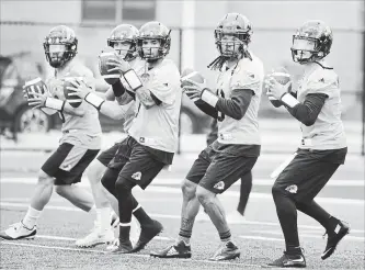  ?? SCOTT GARDNER HAMILTON SPECTATOR FILE PHOTO ?? All five of these quarterbac­ks: Jeremiah Masoli, left, Dane Evans, Vernon Adams Jr., Bryant Moniz and Johnny Manziel will be on the field Friday, just not all on the same team anymore.