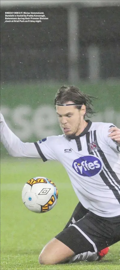  ??  ?? KNEESY DOES IT: Niclas Vemmelund, Dundalk is fouled by Paddy Kavanagh, Bohemians during their Premier Division clash at Oriel Park on Friday night.