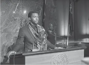  ??  ?? King T'Challa (Chadwick Boseman) has an important announceme­nt for the United Nations in 'Black Panther.' NULL MARVEL STUDIOS