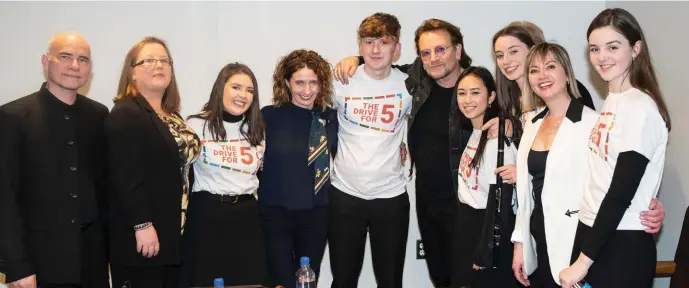  ??  ?? Pictured with Bono, Music Generation Young Ambassador­s perform at the Irish Government’s launch of The Drive For Five. Image Kim Haughton