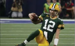  ?? MICHAEL AINSWORTH ?? Green Bay Packers quarterbac­k Aaron Rodgers slides to the ground after running the ball during the second half of the team’s NFL football game against the Dallas Cowboys in Arlington, Texas, Sunday, Oct. 6, 2019.