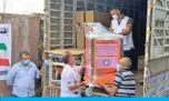  ??  ?? Workers move medical equipment from a truck carrying donations from Kuwait to Lebanese hospitals.