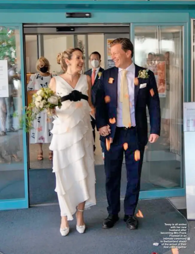  ??  ?? Tessy is all smiles with her new husband after becoming Mrs Frank Floessel in an intimate ceremony in Switzerlan­d ahead of the arrival of their first child together