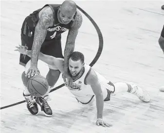  ?? Karen Warren / Houston Chronicle ?? It was all hands on deck in Game 7 as the Rockets’ P.J. Tucker (4) and the Warriors’ Stephen Curry (30) dive for a loose ball in the second half Monday night.