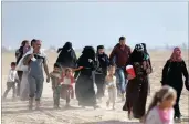  ?? PICTURE: REUTERS ?? Civilians return to their village after it was liberated from Islamic State militants, south of Mosul, Iraq.