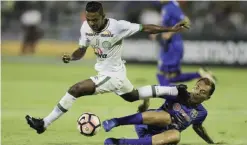  ??  ?? MARACAIBO: Brazil’s Chapecoens­e Niltinho, top, fight for the ball with Venezuela’s Zulia FC Juan Arango during their Copa Libertador­es soccer match in Maracaibo, Venezuela, Tuesday. — AP