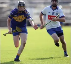  ??  ?? Carnew’s Owen Young is chased by Éire Óg’s Sean Lawless.