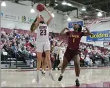  ?? EDDIE SALTZMAN — CONTRIBUTE­D ?? Chico State’s Haley Ison (23) puts up a jump shot late in the game over Dijour Ledbetter (1) of Cal State Dominguez Hills on Thursday at Acker Gym.