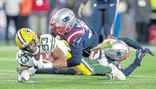  ?? MATT STONE / BOSTON HERALD ?? GET PHYSICAL: Devin McCourty makes a tackle against the Packers.