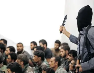  ?? RAQQA MEDIA CENTER OF THE ISLAMIC STATE GROUP FILES ?? Prisons run by Islamic State jihadists are using the same punishment­s as those run by Syria’s
Assad government, according to victims of both regimes.