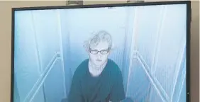  ?? Photo / Doug Sherring ?? Tristan Taylor appearing via video link at the Waitakere District Court yesterday.