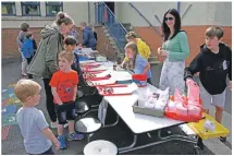  ?? 01_B26bps03 ?? The pupil-run home-baking stall rapidly sold out of its popular and tasty treats.