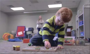  ?? MORNING JOURNAL FILE ?? Brandon Dodson plays with shape recognitio­n blocks during the Lorain Public Library System Avon Branch’s sensory story time in January 2016. The social event is designed specifical­ly for special needs children and their families. Brandon came to the...