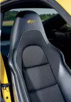  ??  ?? Below Seat centres a retrimmed in Carrera T-specific SportTex fabric, though, confusingl­y, full leather remains on door cards and dash