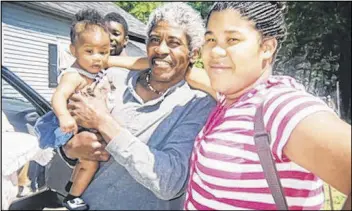  ?? CONTRIBUTE­D ?? Walter Folds, pictured here with daughter Nicorya Fambro and grandchild O’lillian, was fatally shot by a Griffin police officer in 2012. Folds’ family only recently found out that the officer had been indicted in the case, only to have the charges...