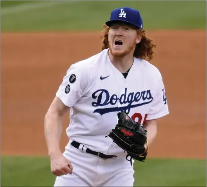  ?? HARRY HOW — GETTY IMAGES ?? Dustin May, who underwent elbow ligament replacemen­t surgery in May 2021, may make his final minor league injury rehab start tonight.