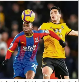  ??  ?? Juggling act: Crystal Palace’s Aaron Wan-Bissaka (left) in action with Wolverhamp­ton’s Raul Jimenez during their Premier League match on Wednesday. — Reuters