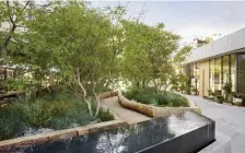  ??  ?? FRESH AIR: An ‘outdoor lobby’ at 1 Hotel in West Hollywood, Calif., functions as an extension of the hotel’s interior space. Log seating and timber planters were created from salvaged Los Angeles-area fallen trees.