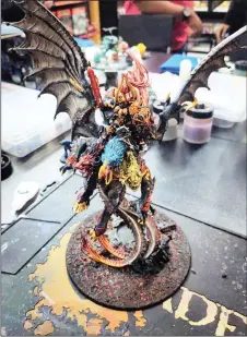  ??  ?? A painted miniature figurine of Archaon, the greatest champion of the Chaos dods.