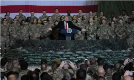  ?? Photograph: Olivier Douliery/AFP via Getty Images ?? Donald Trump speaks to the troops during a surprise Thanksgivi­ng Day visit at Bagram airfield in Afghanista­n.