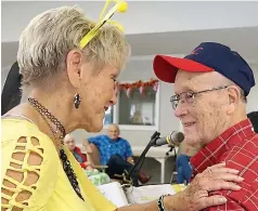  ??  ?? ■ Carolyn Johnson welcomes Bobby Allday back to making music at Golden Villa Nursing Home. Allday had recently been too ill to continue his 30-year stint.
